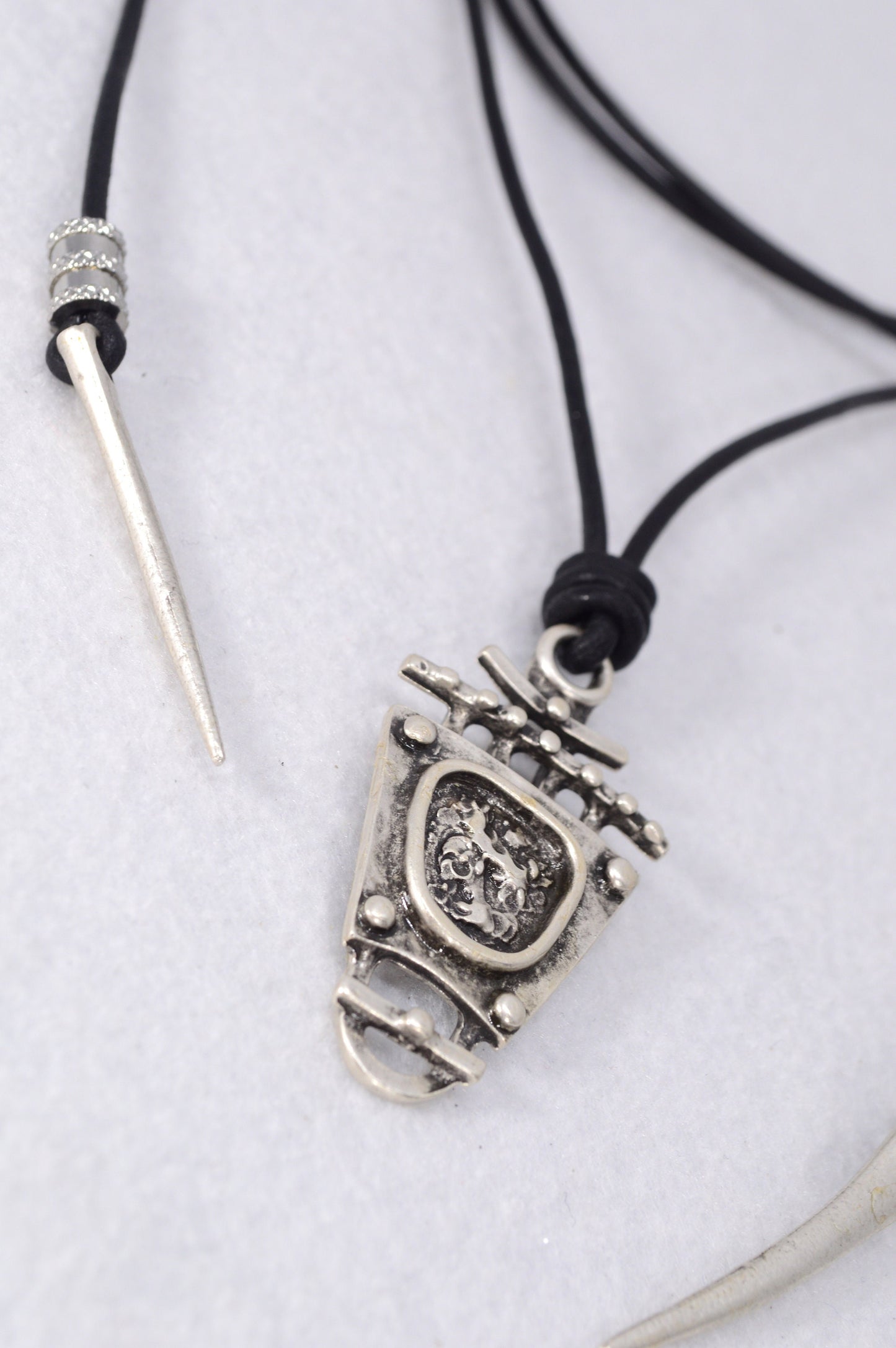 Tribal boho pendant. Black leather cord necklace trends. Boho chic accessory for women. Estibela design.
