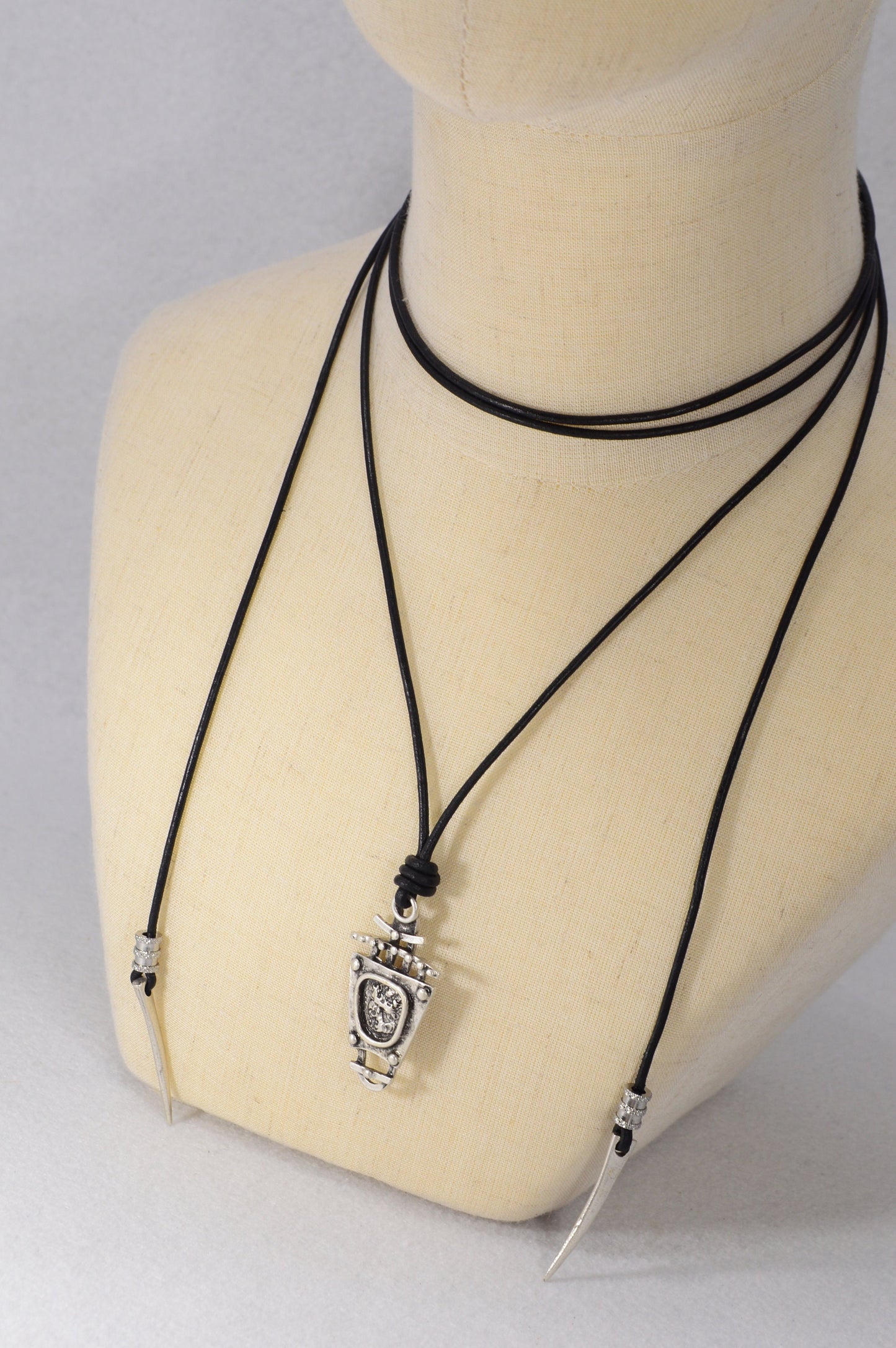 Tribal boho pendant. Black leather cord necklace trends. Boho chic accessory for women. Estibela design.