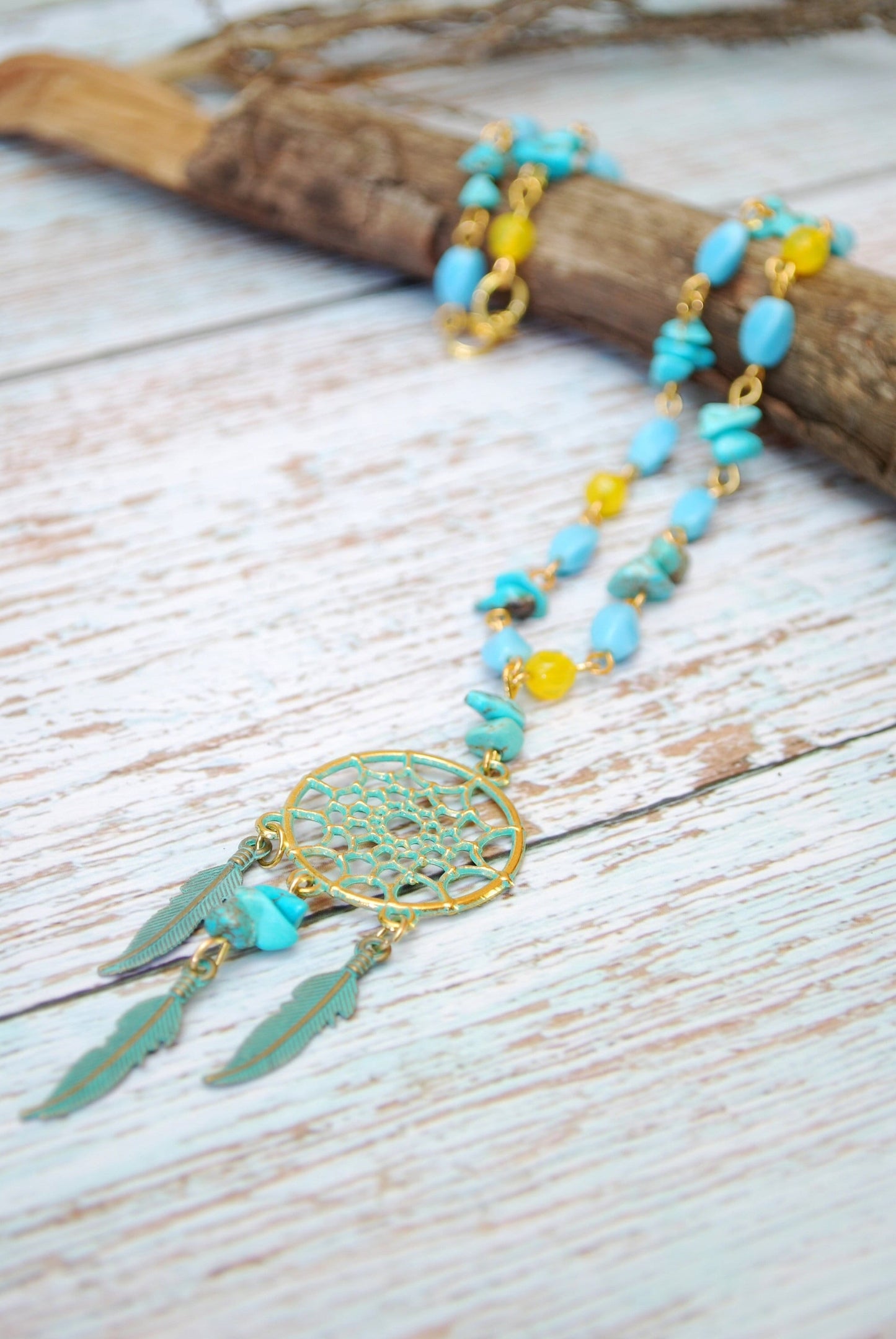 Spiritual Native American-Inspired Gold Pendant Necklace featuring Turquoise Quartz Stone and Beaded Feathers.  Estibeela design. 20"