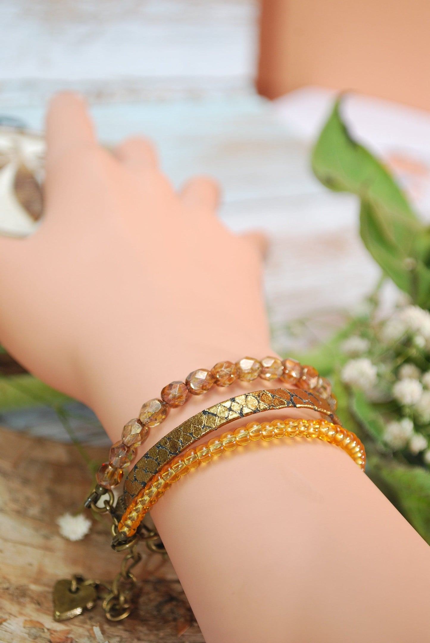 Golden Serpent Leather Wrap Bracelet: Multilayered Adjustable Women's Accessory with Bronze-Toned Glass Beads - Exude Elegance and Style.