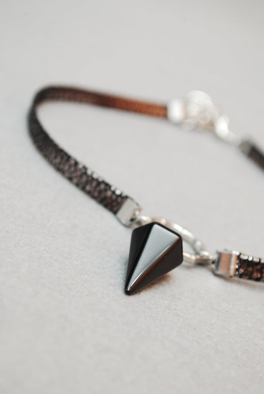 Black leather choker. Genuine leather, stainless steel ring, and calcite pendant. Edgy and stylish. 13 inches + additional chain