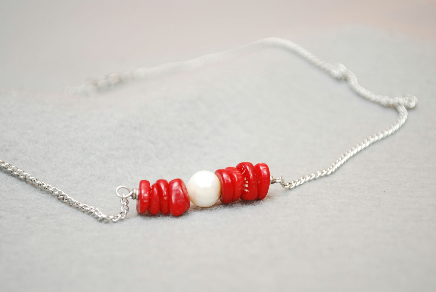 Ocean Breeze: Stainless Steel Necklace with Freshwater Pearl Center and Coral Stones. Estibela design.