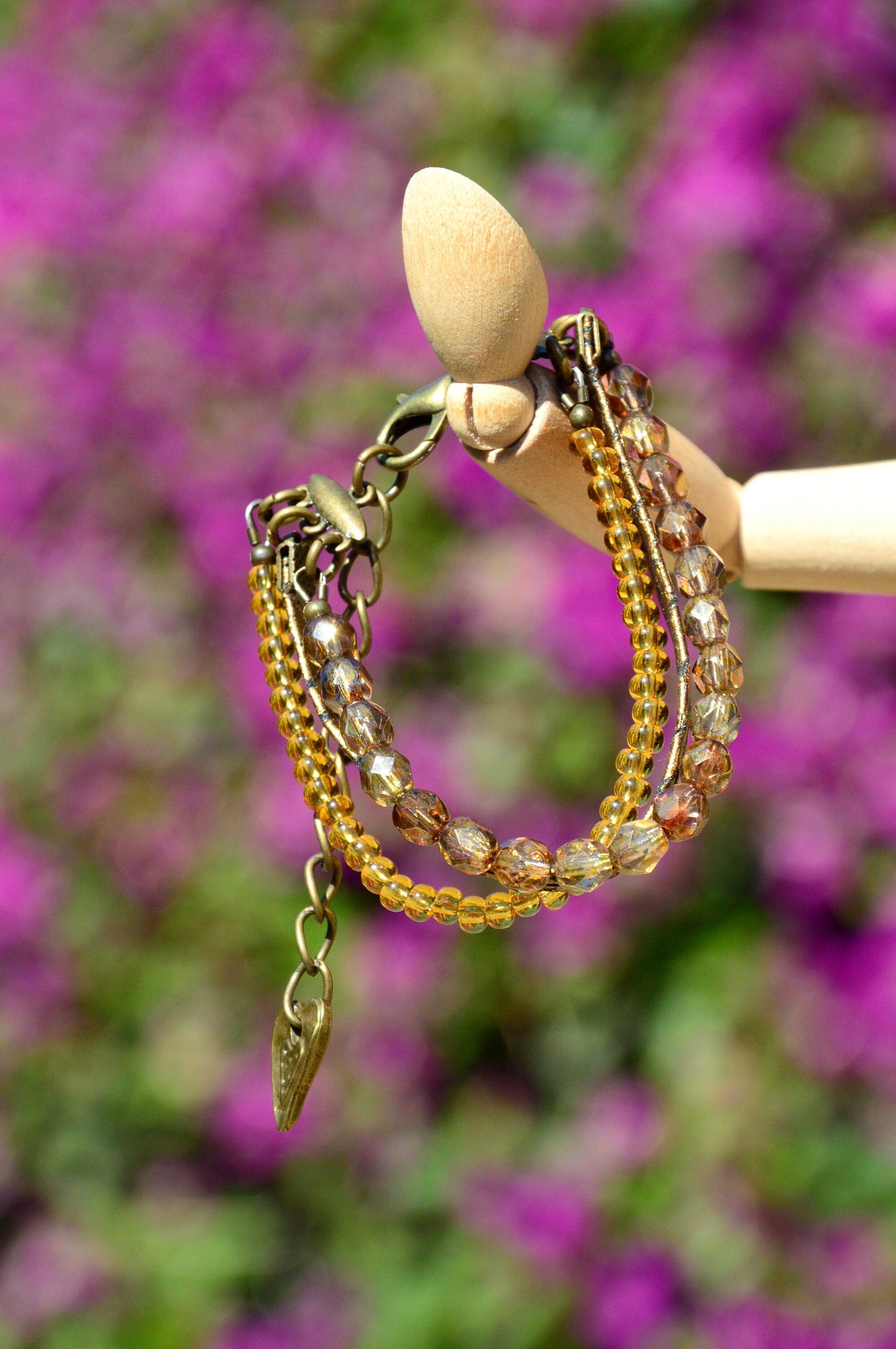 Golden Serpent Leather Wrap Bracelet: Multilayered Adjustable Women's Accessory with Bronze-Toned Glass Beads - Exude Elegance and Style.