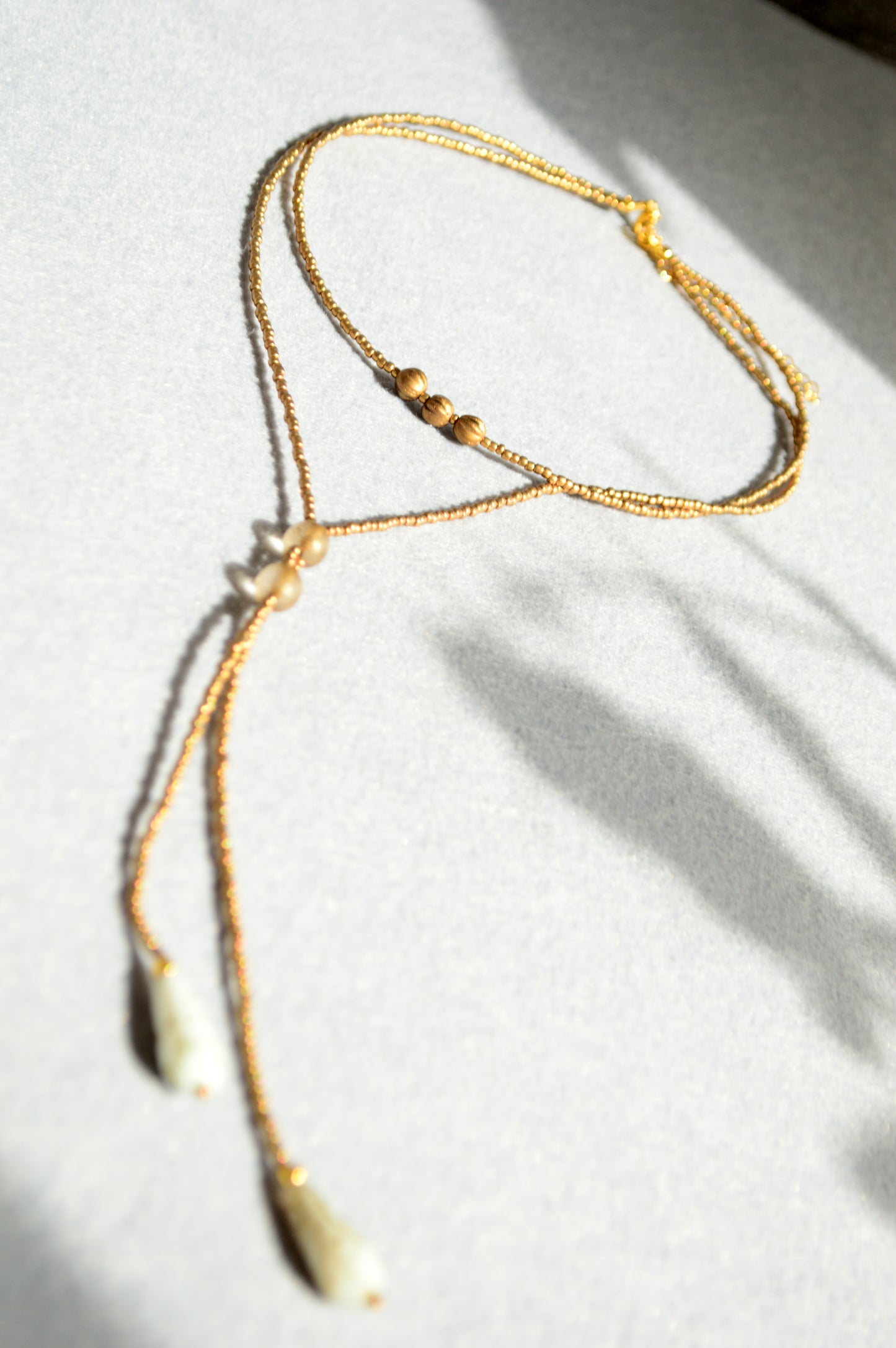 Gold Beaded Lariat Necklace with White Marble Glass Drops – Adjustable Minimalist Y Necklace
