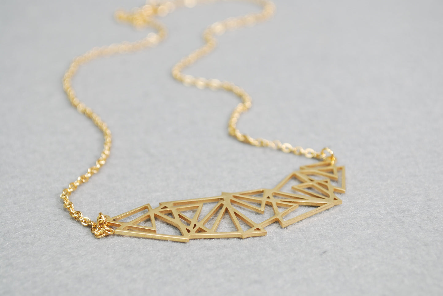 Stainless steel geometric abstract necklace, suitable for both casual and formal occasions. Makes a great gift idea.