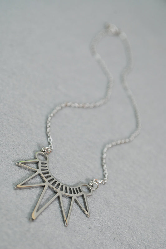 Egypt Style Necklace is a bohemian charm in stainless steel. Geometric design adds a splash of personality to any outfit