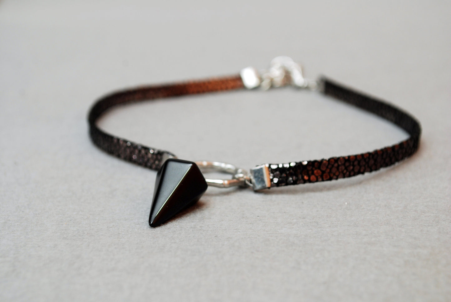 Black leather choker. Genuine leather, stainless steel ring, and calcite pendant. Edgy and stylish. 13 inches + additional chain