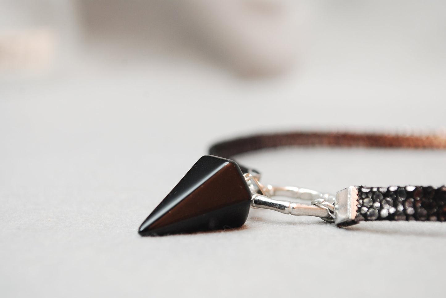 Black leather choker. Genuine leather, stainless steel ring, and calcite pendant. Edgy and stylish. 13 inches + additional chain