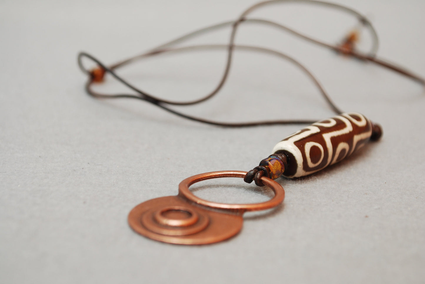 Handcrafted Leather Necklace with Tibetan Agate Dzi Bead and Czech Glass Beads. Adjustible length.