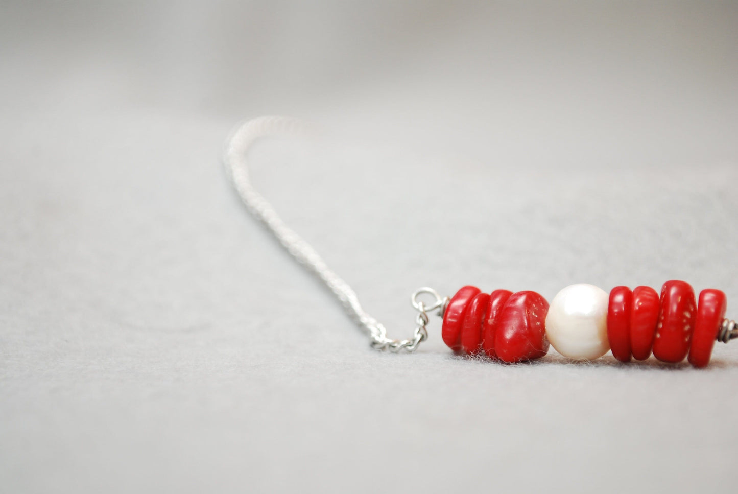 Ocean Breeze: Stainless Steel Necklace with Freshwater Pearl Center and Coral Stones. Estibela design.