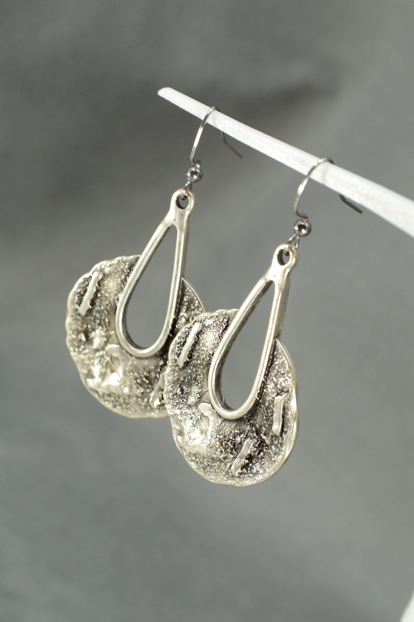 Tribal Harmony Earrings infuse boho allure with stunning metal drops and intricate patterns for bold fashion statements