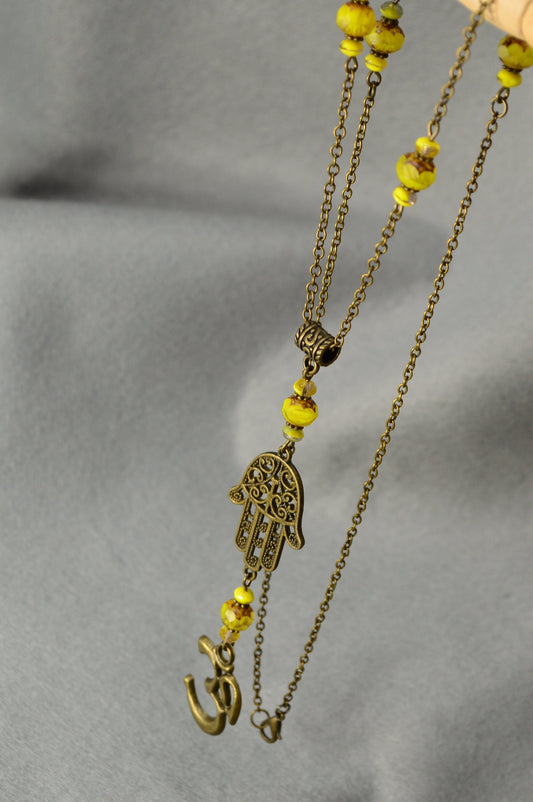 Golden Aura: Bronze Chain Necklace Adorned with Yellow Glass Beads and Spiritual Pendants