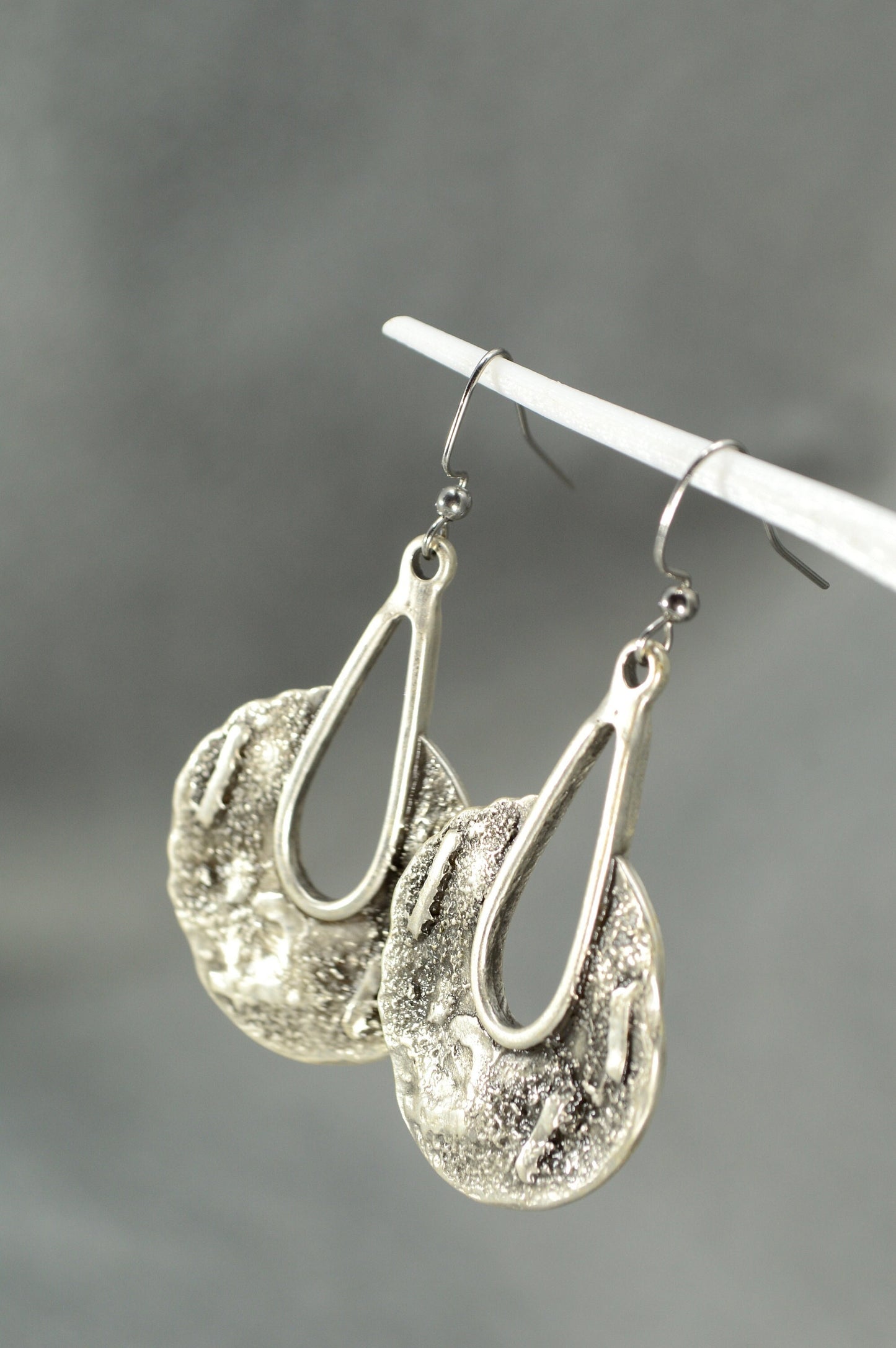 Tribal Harmony Earrings infuse boho allure with stunning metal drops and intricate patterns for bold fashion statements