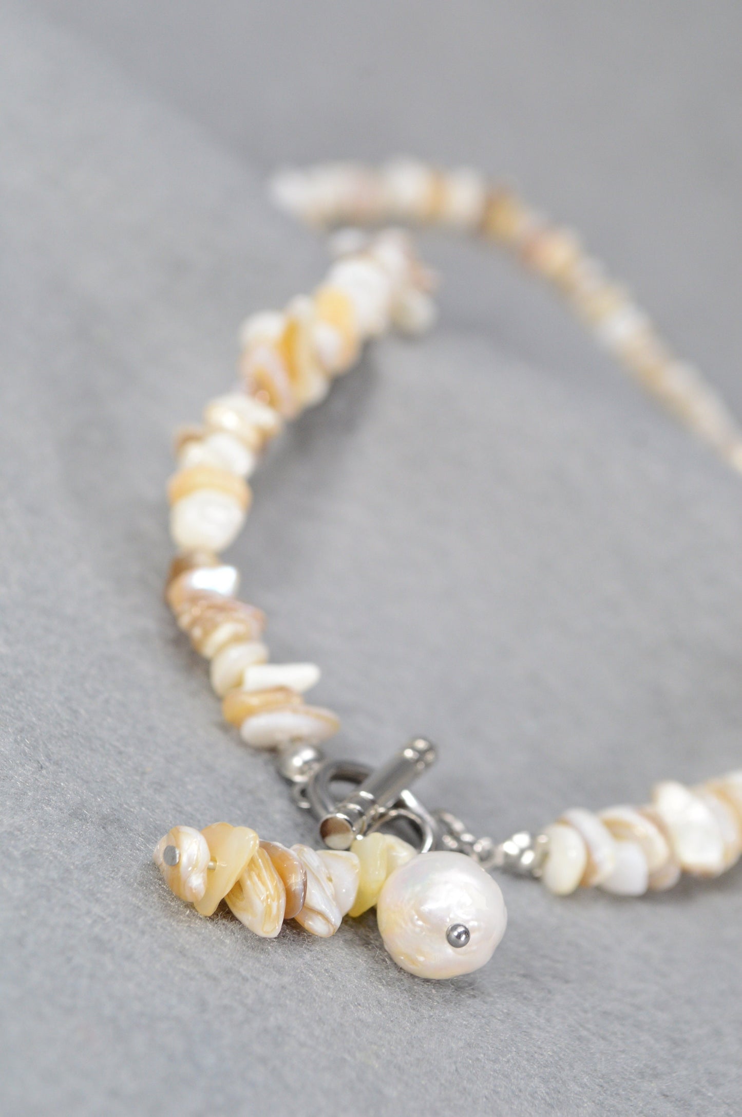 Coral necklace with baroque freshwater pearl for elegant coastal chic style, perfect for casual and formal occasions. Estibela design.