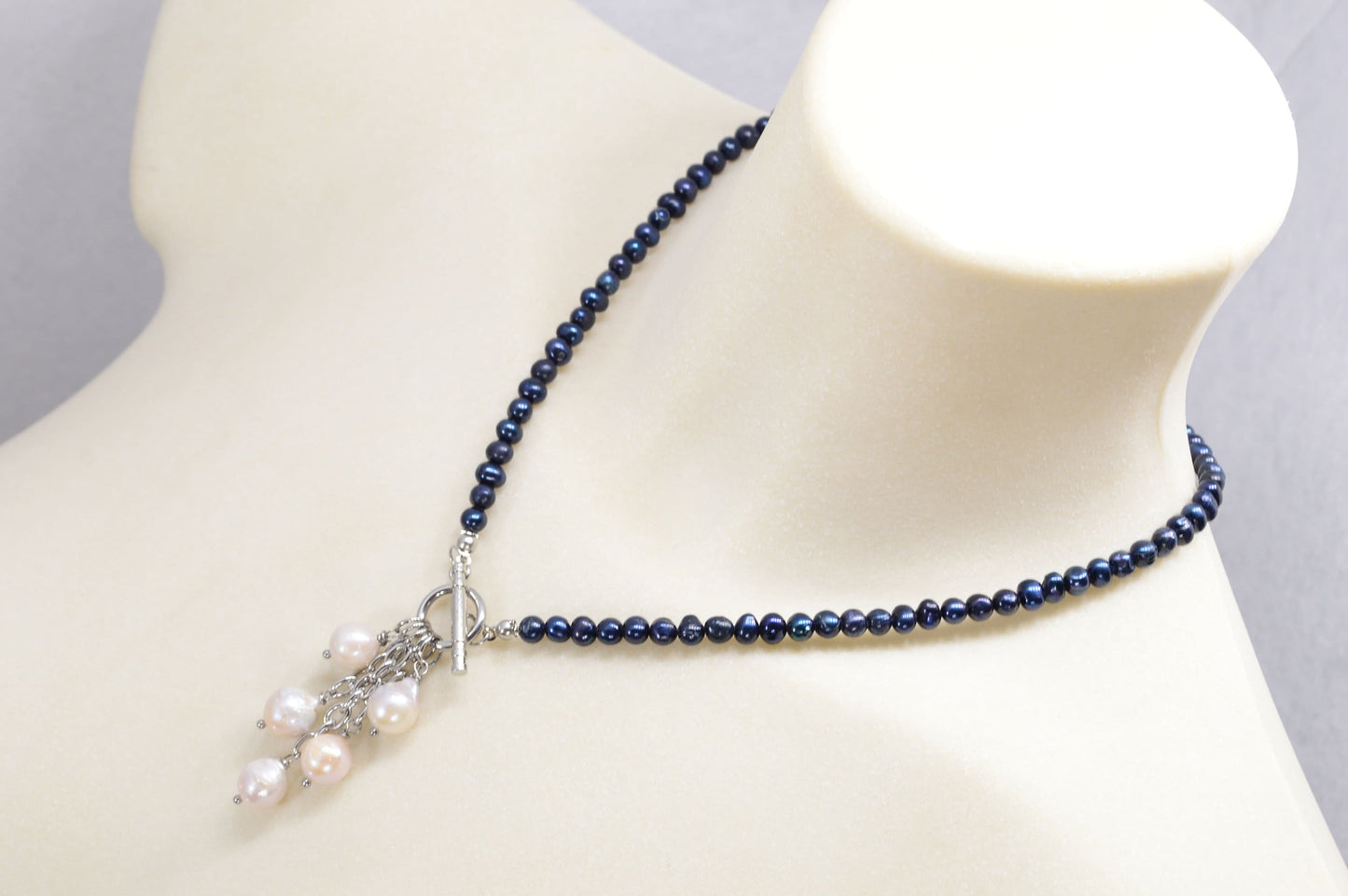 Dark blue freshwater pearl necklace with toggle clasp and baroque pearls,  unique Estibela design. Cascading baroque pearls pendant