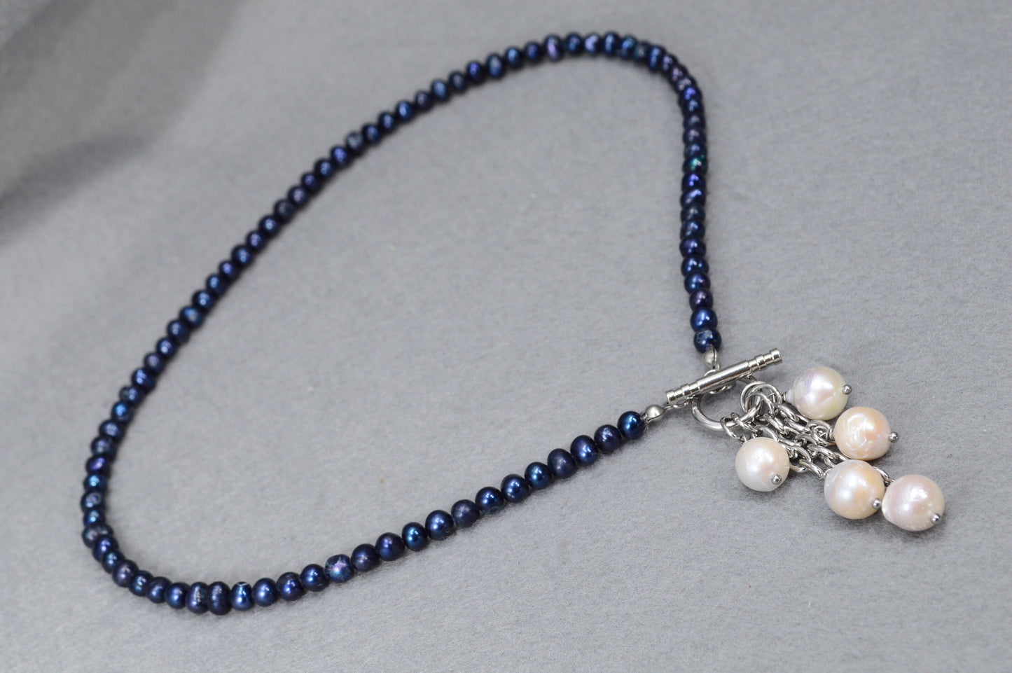 Dark blue freshwater pearl necklace with toggle clasp and baroque pearls,  unique Estibela design. Cascading baroque pearls pendant