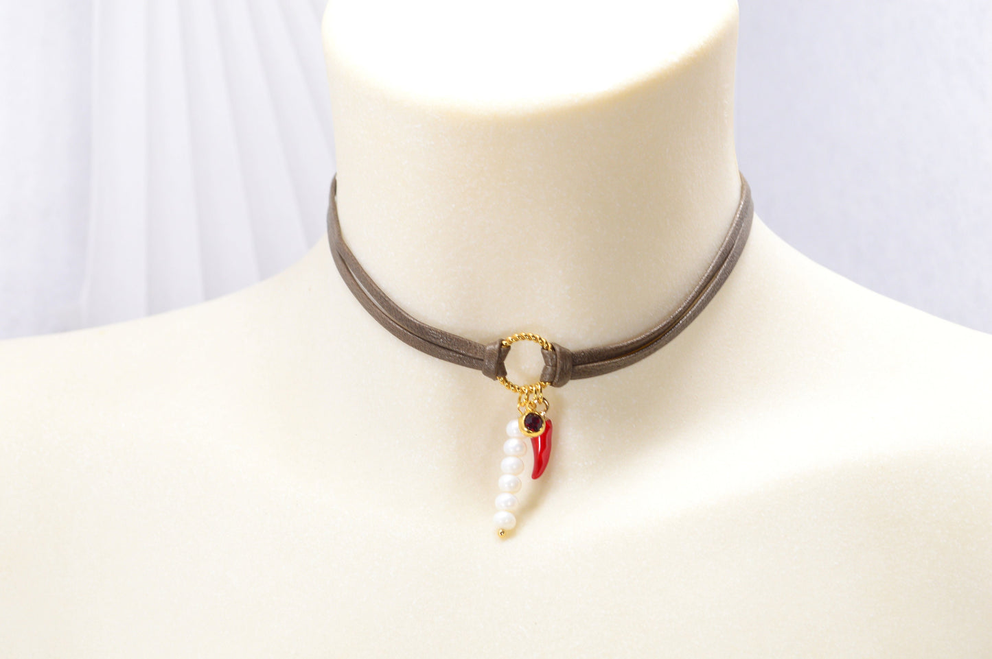 Red chili pepper pendant on this Estibela choker adds bold flair, complemented by a red glass bead and river pearls on soft leather.