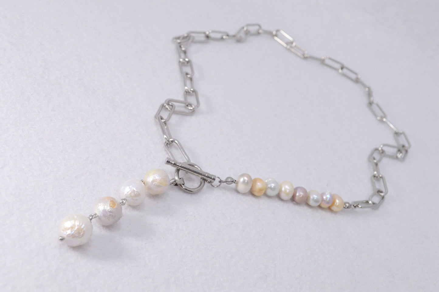 Baroque Pearls Boho Necklace. Ethereal Radiance: Boho Pearl Cascade Necklace in Stainless Steel.