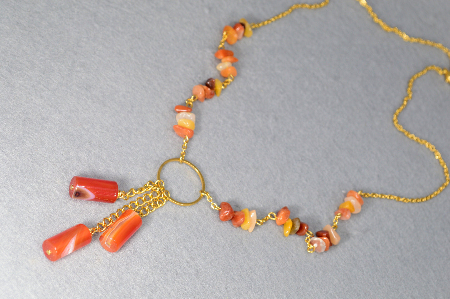 Sophisticated golden necklace adorned with agate stone beads. Unique Estibela collection. Agate bead chain accessory. Evening wear.