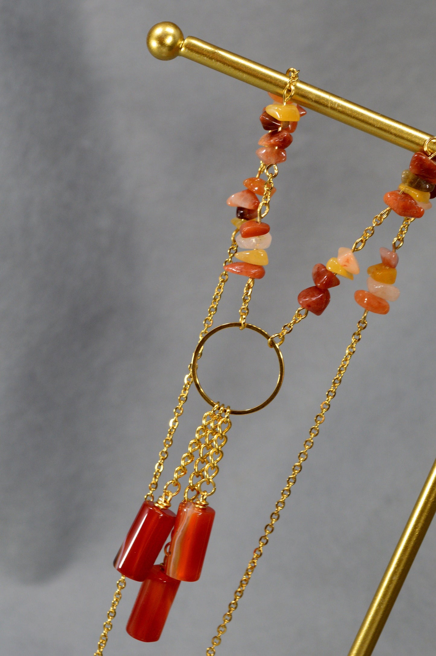 Sophisticated golden necklace adorned with agate stone beads. Unique Estibela collection. Agate bead chain accessory. Evening wear.