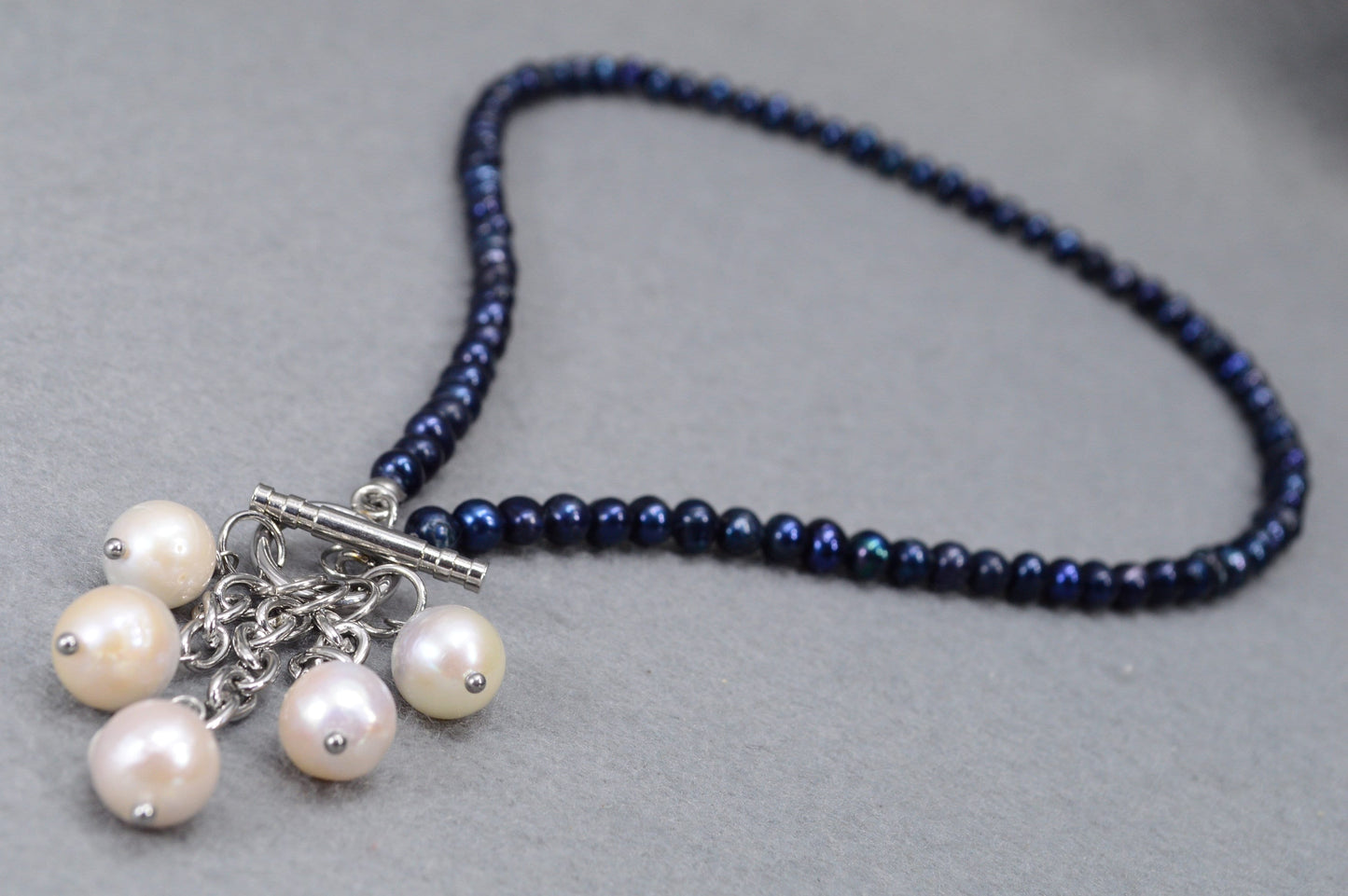 Dark blue freshwater pearl necklace with toggle clasp and baroque pearls,  unique Estibela design. Cascading baroque pearls pendant