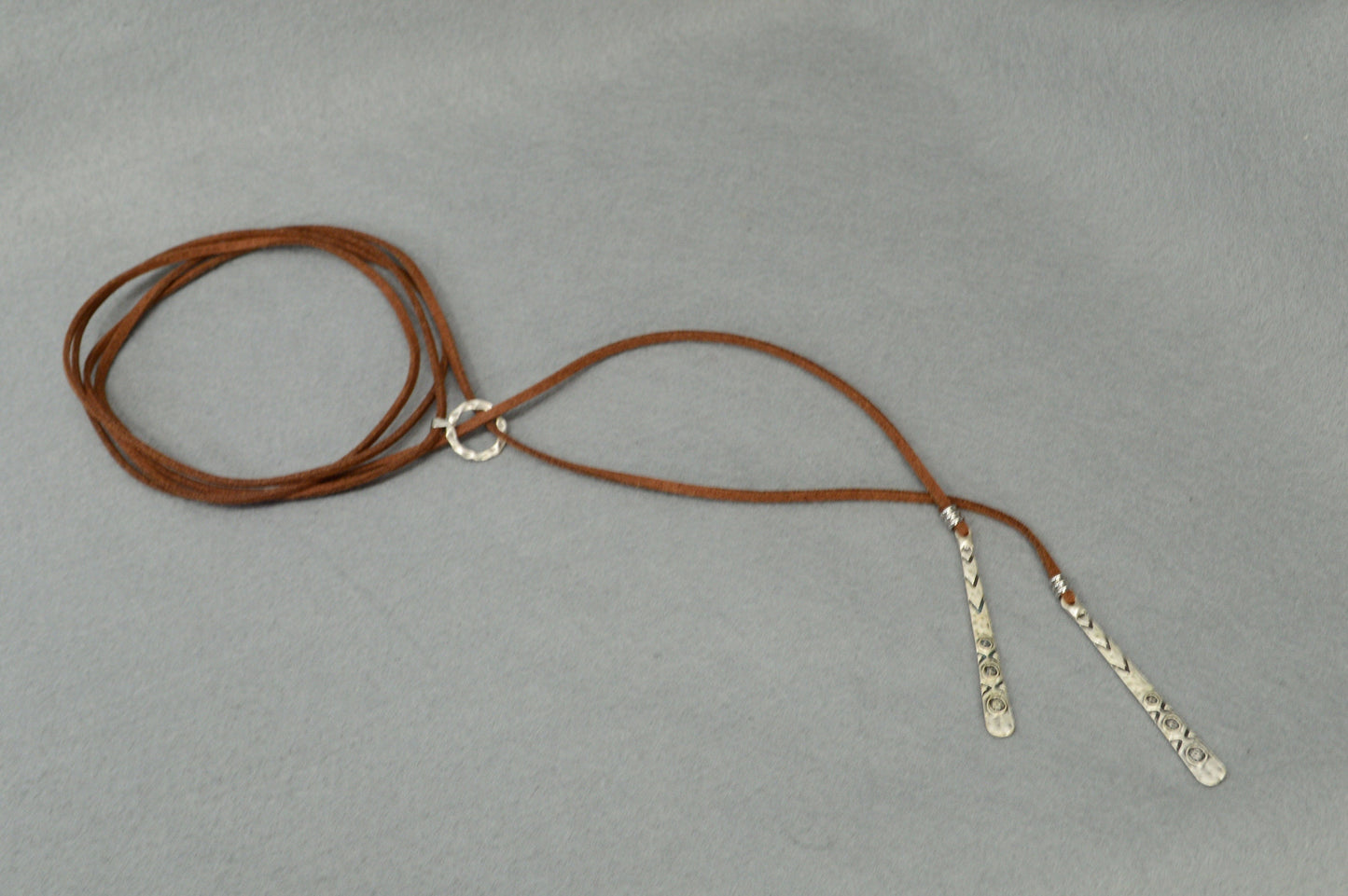 Long brown faux leather necklace featuring a boho chic Y-necklace design. Elegant festival wrap necklace for a unique gift for her.