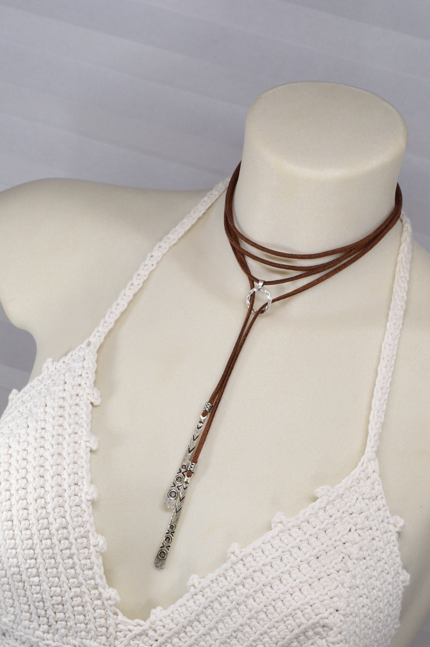 Long brown faux leather necklace featuring a boho chic Y-necklace design. Elegant festival wrap necklace for a unique gift for her.