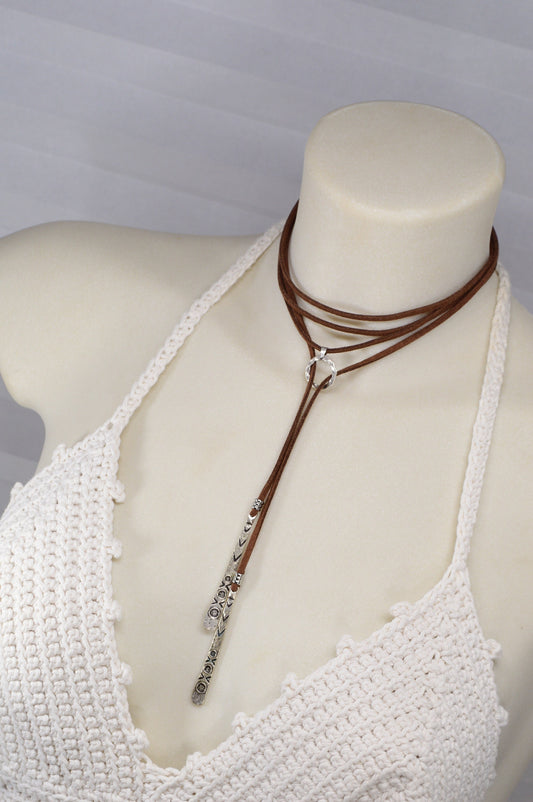 Long brown faux leather necklace featuring a boho chic Y-necklace design. Elegant festival wrap necklace for a unique gift for her.