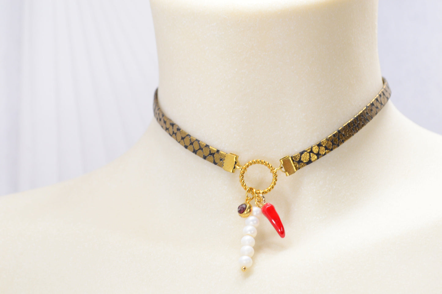 Fiery Serpent Choker: Golden Leather with Snake Skin Texture, Red Glass Bead, and Chili Pepper Pendant. Estibela unique design.