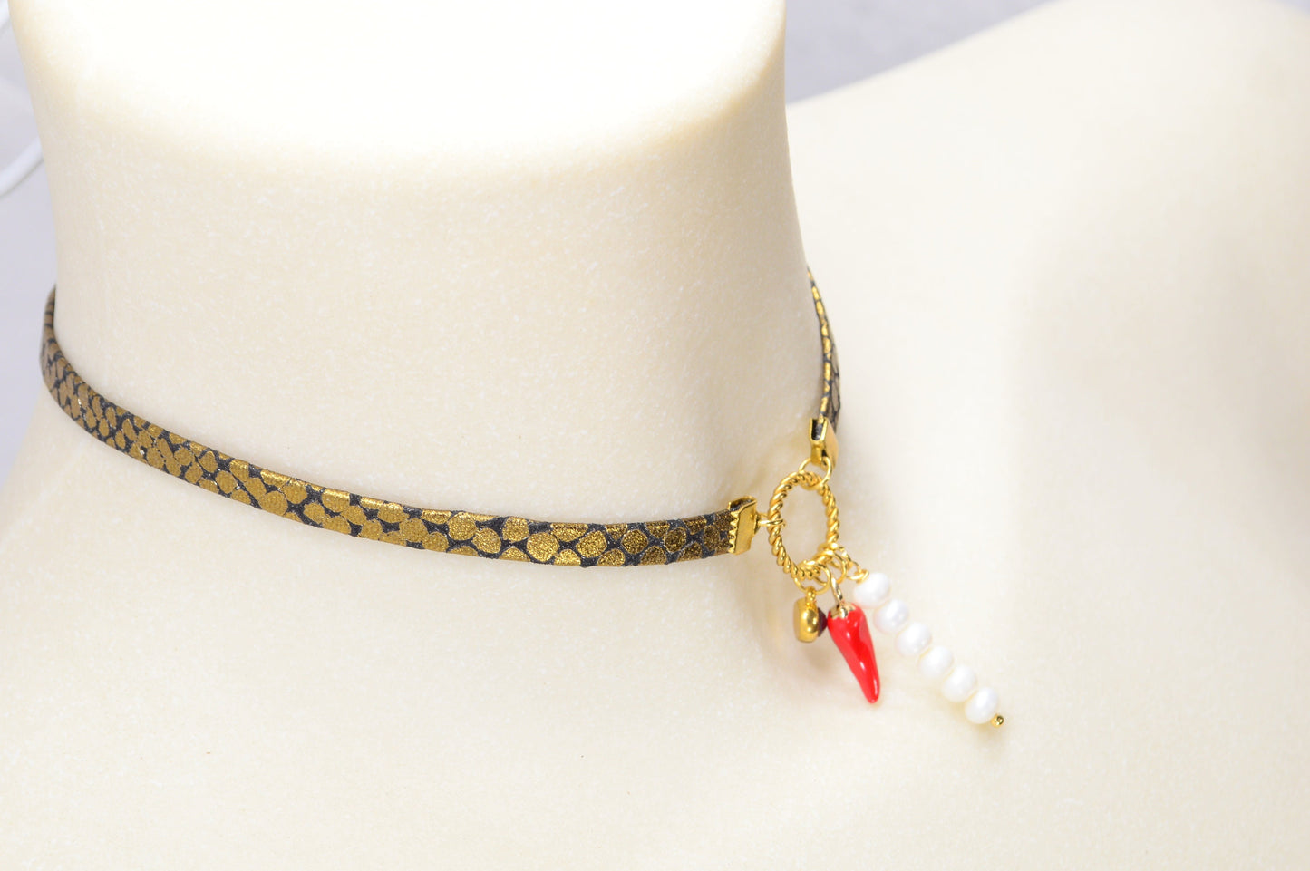 Fiery Serpent Choker: Golden Leather with Snake Skin Texture, Red Glass Bead, and Chili Pepper Pendant. Estibela unique design.