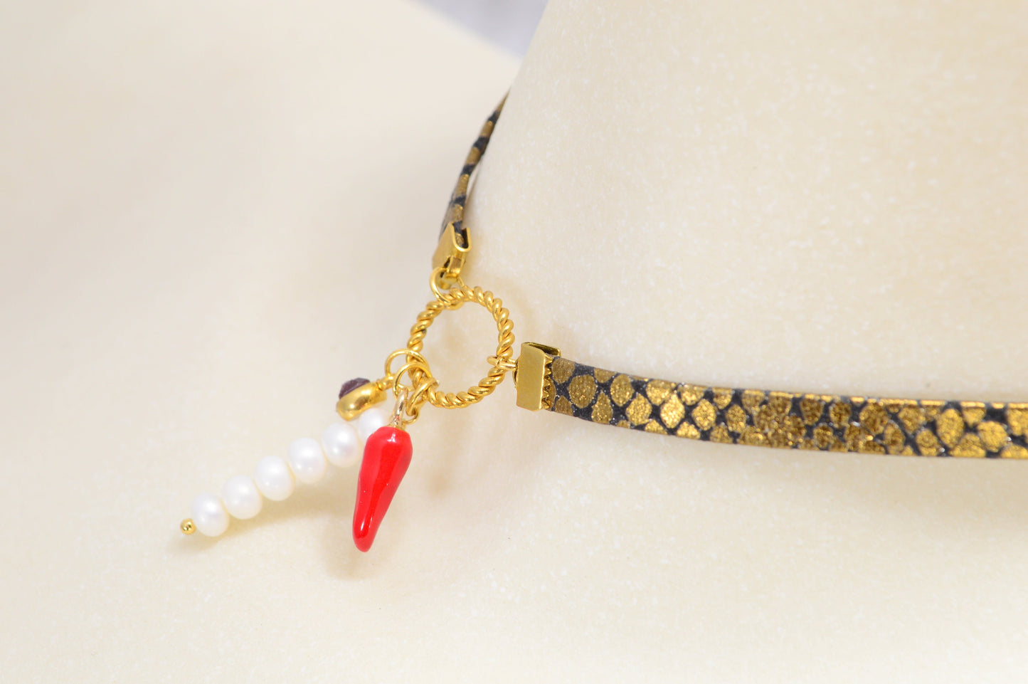 Fiery Serpent Choker: Golden Leather with Snake Skin Texture, Red Glass Bead, and Chili Pepper Pendant. Estibela unique design.